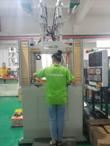 Vertical insert injection molding